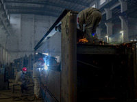 A worker is working at a workshop of a manufacturing enterprise in Hai'an, Jiangsu Province, China, on December 14, 2023. (