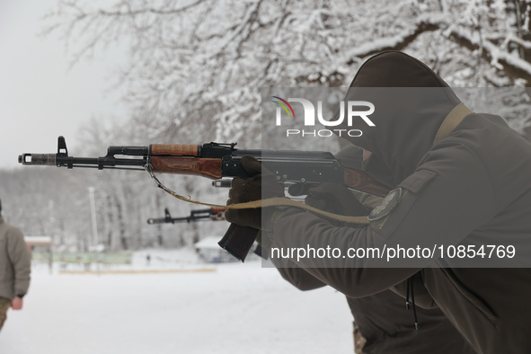 Servicemen are exercising with rifles while senior sergeants from the units of the Eastern Operational and Territorial Command of the Nation...