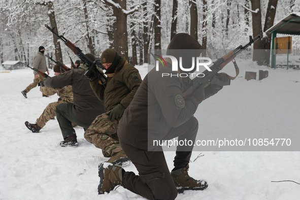 Servicemen are exercising with rifles while senior sergeants from the units of the Eastern Operational and Territorial Command of the Nation...