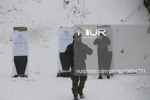 Servicemen are practicing at a shooting range while senior sergeants from the units of the Eastern Operational and Territorial Command of th...