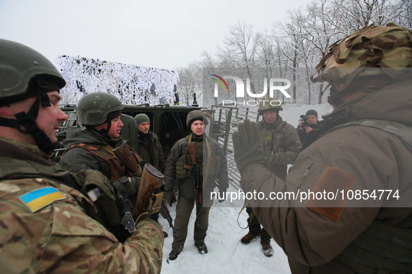 Servicemen are listening to an instructor as senior sergeants from the units of the Eastern Operational and Territorial Command of the Natio...