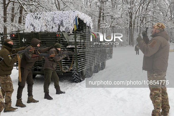 Servicemen are listening to an instructor as senior sergeants from the units of the Eastern Operational and Territorial Command of the Natio...