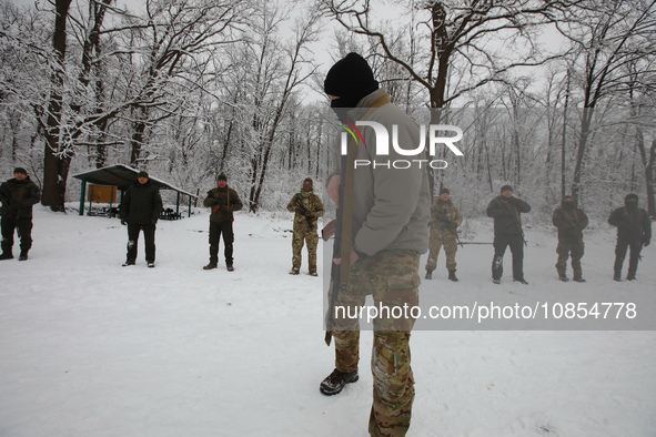 Servicemen are exercising with rifles while senior sergeants from the units of the Eastern Operational and Territorial Command of the Nation...