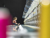 A worker is making embroidery orders at a workshop of a textile enterprise in Congjiang County, Guizhou Province, China, on December 15, 202...