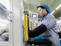 A worker is producing motor products at a motor production workshop in Nantong, Jiangsu Province, China, on December 15, 2023. (