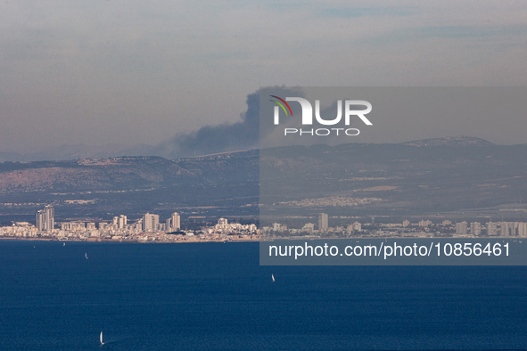 Clouds of smoke are billowing from Israel's northern port city of Haifa on the Mediterranean Coast after an explosion of undetermined origin...