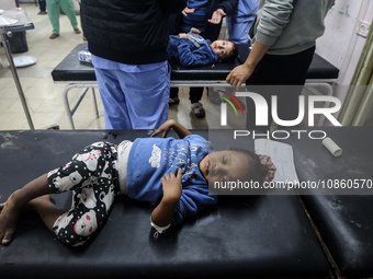 Medics are transporting Palestinians injured in Israeli bombardment into Shuhada Al-Aqsa Hospital in Deir El-Balah, in the central Gaza Stri...