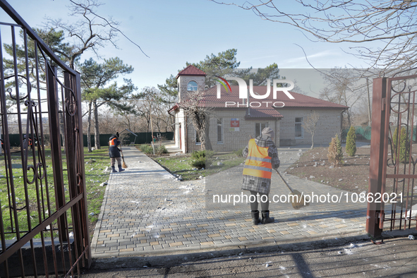 People are cleaning up the rubble after Russian shelling of a residential area in Odesa Region, southern Ukraine, on December 17, 2023. No u...