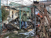 A man is standing outside a house that has been damaged by Russian shelling in the Odesa Region, southern Ukraine, on December 17, 2023. (