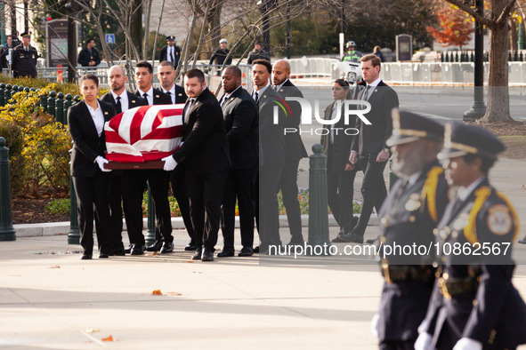 Supreme Court Police officers stand at attention as the casket of retired Associate Justice Sandra Day O’Connor, the first woman to serve on...