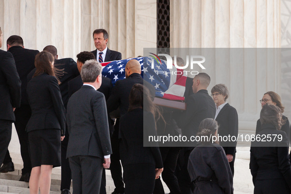 The flag-draped casket of Associate Justice Sandra Day O’Connor, the first woman to serve on the Supreme Court, passes between two lines of...