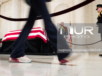 A person walks by the casket of retired Associate Justice Sandra Day O’Connor, the first woman to serve on the Supreme Court, after paying t...