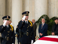 Supreme Court Police officers salute retired Associate Justice Sandra Day O’Connor, the first woman to serve on the Supreme Court, during a...