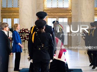 Supreme Court Police officers salute retired Associate Justice Sandra Day O’Connor, the first woman to serve on the Supreme Court, during a...