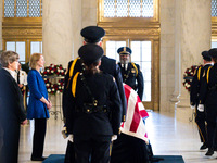 Supreme Court Police officers salute retired Associate Justice Sandra Day O’Connor, the first woman to serve on the Supreme Court, during a...