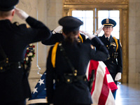 Supreme Court Police officers salute retired Associate Justice Sandra Day O’Connor, the first woman to serve on the Supreme Court, during a...