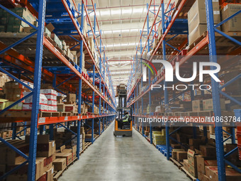 Workers are sorting materials at a warehouse in Huai'an City, Jiangsu Province, China, on December 19, 2023. (