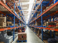 Workers are sorting materials at a warehouse in Huai'an City, Jiangsu Province, China, on December 19, 2023. (