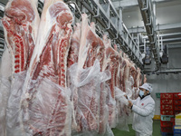 Workers are sorting materials at a warehouse in Huai'an City, Jiangsu Province, China, on December 19, 2023. (