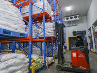 Workers are sorting materials at a warehouse in Huai'an City, Jiangsu Province, China, on December 19, 2023. (