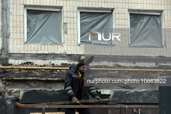 A welder is working on the residential building at 4A Ostafiia Dashkevycha Street in Kyiv, Ukraine, on December 18, 2023, which was damaged...