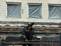 A welder is working on the residential building at 4A Ostafiia Dashkevycha Street in Kyiv, Ukraine, on December 18, 2023, which was damaged...