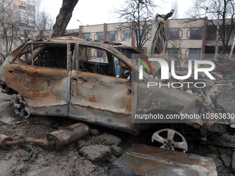 In Kyiv, Ukraine, on December 18, 2023, a burnt-out car is being seen in the yard of a residential building at 4A Ostafiia Dashkevycha Stree...