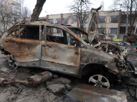 In Kyiv, Ukraine, on December 18, 2023, a burnt-out car is being seen in the yard of a residential building at 4A Ostafiia Dashkevycha Stree...