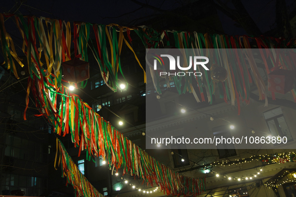 String lights and ribbon garland are hanging across a street at night in Kyiv, Ukraine, on December 18, 2023. NO USE RUSSIA. NO USE BELARUS....