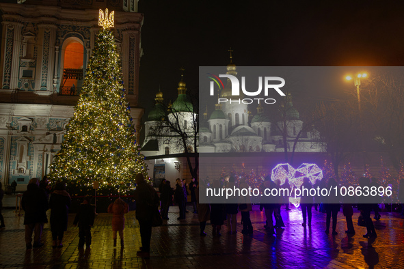 The main Christmas tree of Ukraine, crowned by the national coat of arms, is standing in Sofiiska Square outside Saint Sophia Cathedral in K...