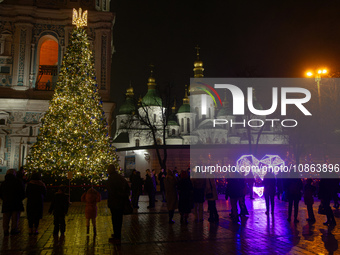 The main Christmas tree of Ukraine, crowned by the national coat of arms, is standing in Sofiiska Square outside Saint Sophia Cathedral in K...