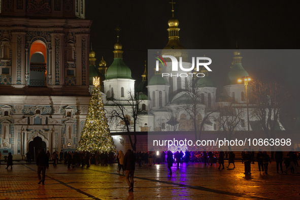 The main Christmas tree of Ukraine, crowned by the national coat of arms, is standing in Sofiiska Square outside Saint Sophia Cathedral in K...