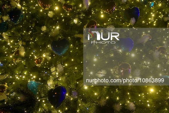 Heart-shaped blue and gold baubles are decorating the main Christmas tree of Ukraine in Sofiiska Square, Kyiv, Ukraine, on December 18, 2023...