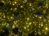Heart-shaped blue and gold baubles are decorating the main Christmas tree of Ukraine in Sofiiska Square, Kyiv, Ukraine, on December 18, 2023...