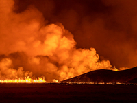 A volcano spews lava and smoke as it erupts in Grindavik, Iceland, December 18, 2023. (