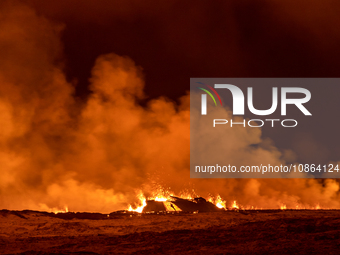 A volcano spews lava and smoke as it erupts in Grindavik, Iceland, December 18, 2023. (