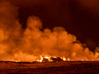 A volcano spews lava and smoke as it erupts in Grindavik, Iceland, December 18, 2023. (