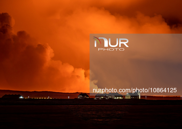 A view of the Bessastadir, the official residence of President of Iceland as volcano spews lava and smoke as it erupts in Grindavik, Iceland...