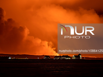 A view of the Bessastadir, the official residence of President of Iceland as volcano spews lava and smoke as it erupts in Grindavik, Iceland...