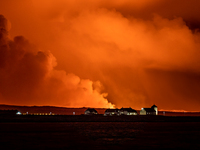 A view of the Bessastadir, the official residence of President of Iceland as volcano spews lava and smoke as it erupts in Grindavik, Iceland...