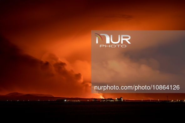 A view of the Bessastadir, the official residence of President of Iceland as volcano spews lava and smoke as it erupts in Grindavik, Iceland...