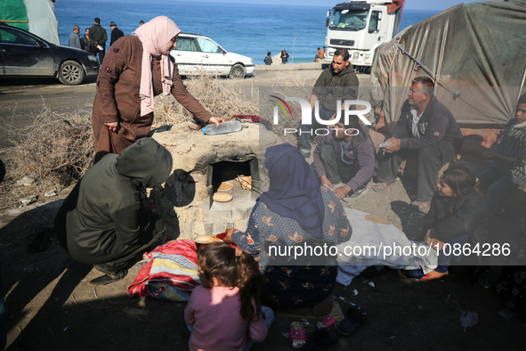 Displaced Palestinians are baking bread in Deir el-Balah, in the central Gaza Strip, on December 19, 2023, amid ongoing battles between Isra...