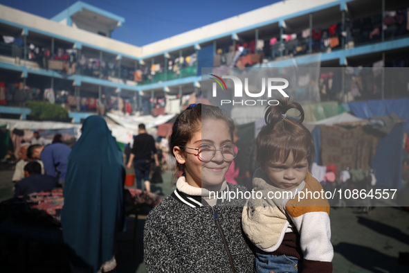 Displaced Palestinians are taking shelter in a UNRWA-affiliated Deir al-Balah school after fleeing their homes due to Israeli strikes, amid...