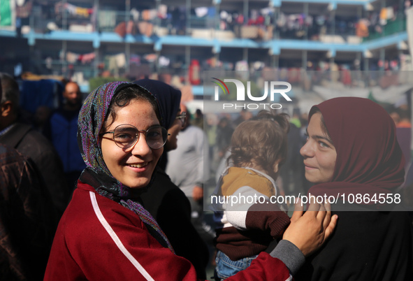 Displaced Palestinians are taking shelter in a UNRWA-affiliated Deir al-Balah school after fleeing their homes due to Israeli strikes, amid...