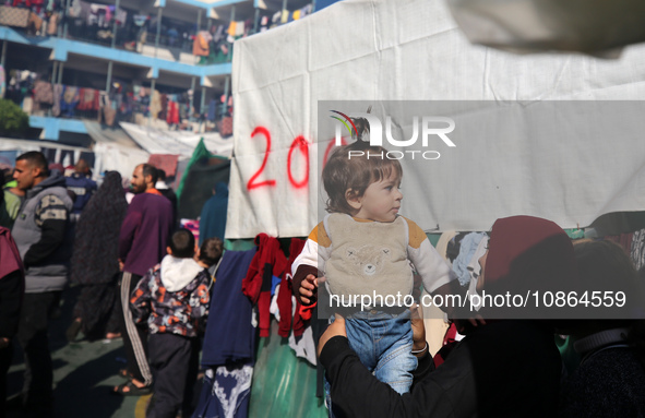 Displaced Palestinians are taking shelter in a UNRWA-affiliated Deir al-Balah school after fleeing their homes due to Israeli strikes, amid...