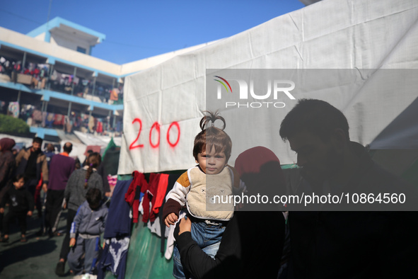 Displaced Palestinians are taking shelter in a UNRWA-affiliated Deir al-Balah school after fleeing their homes due to Israeli strikes, amid...