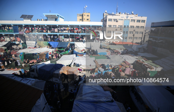 Displaced Palestinians are taking shelter in a UNRWA-affiliated Deir al-Balah school after fleeing their homes due to Israeli strikes, amid...