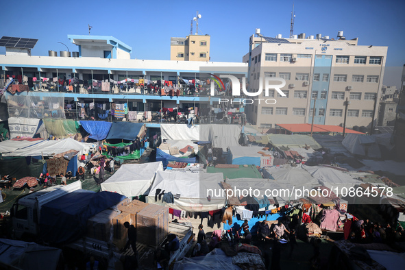 Displaced Palestinians are taking shelter in a UNRWA-affiliated Deir al-Balah school after fleeing their homes due to Israeli strikes, amid...