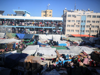 Displaced Palestinians are taking shelter in a UNRWA-affiliated Deir al-Balah school after fleeing their homes due to Israeli strikes, amid...