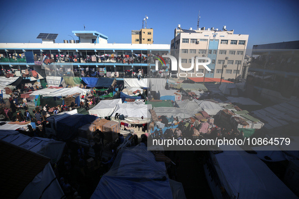 Displaced Palestinians are taking shelter in a UNRWA-affiliated Deir al-Balah school after fleeing their homes due to Israeli strikes, amid...